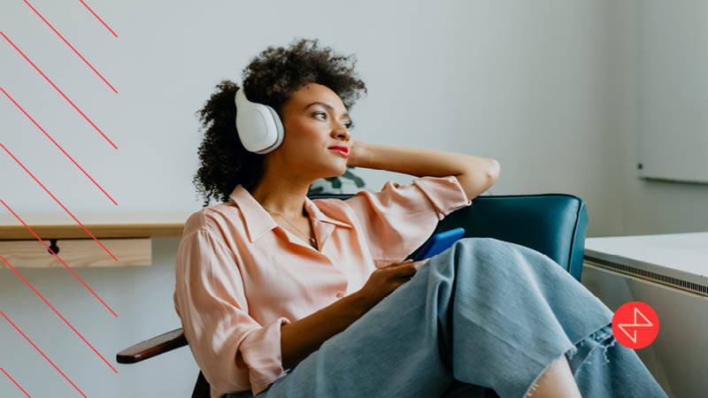 woman listening to digital audio while relaxing around the house